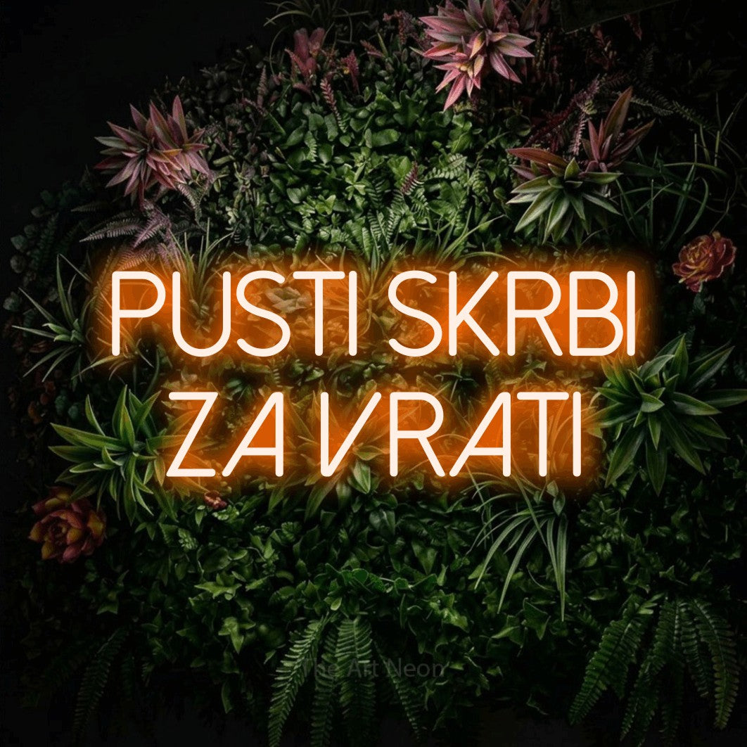LED neon sign reading “PUSTI SKRBI ZA VRATI”, arranged in two lines.