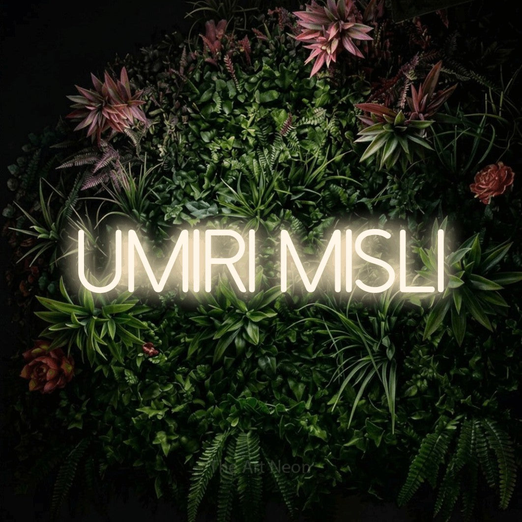 LED neon sign reading “UMIRI MISLI”, arranged in a single line.