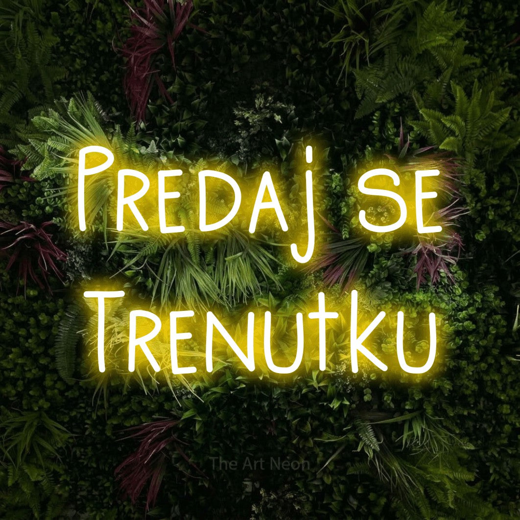 LED neon sign reading “Predaj se Trenutku”, arranged in two lines.
