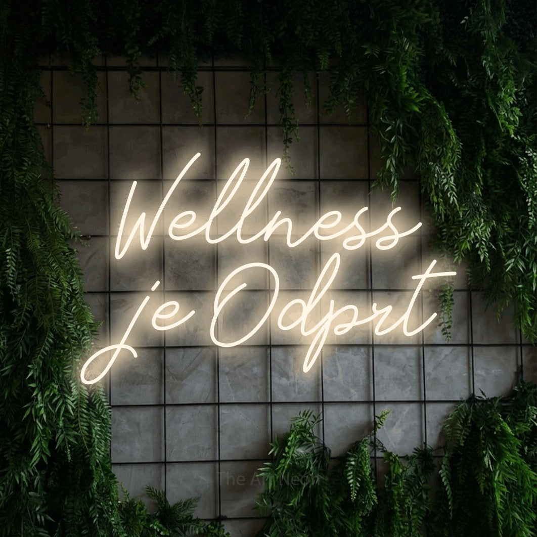 LED neon sign reading “Wellness je Odprt”, arranged in two lines.
