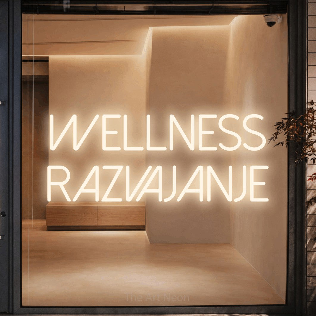 LED neon sign reading “Wellness Razvajanje”, arranged in two lines.