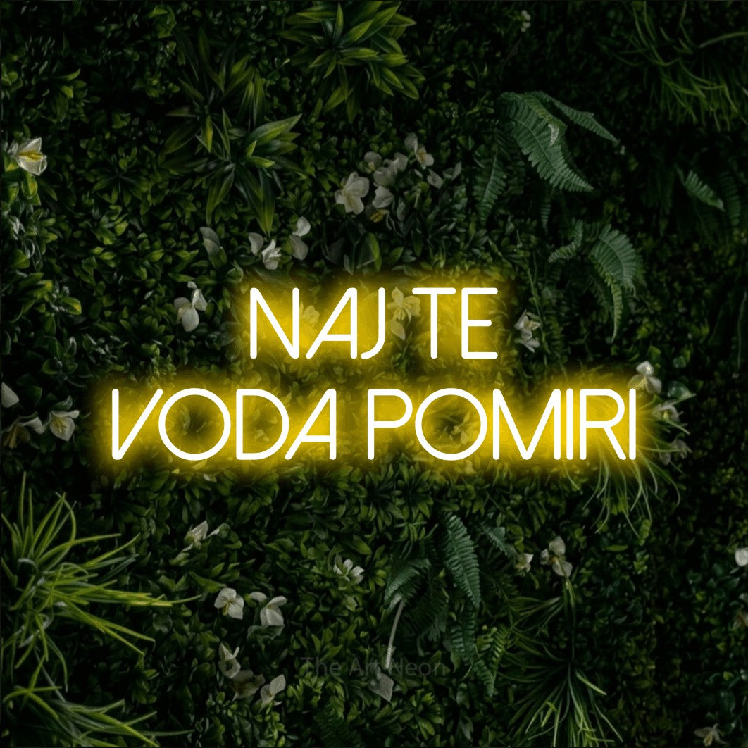 LED neon sign reading “Naj Te Voda POMIRI”, arranged in two lines.