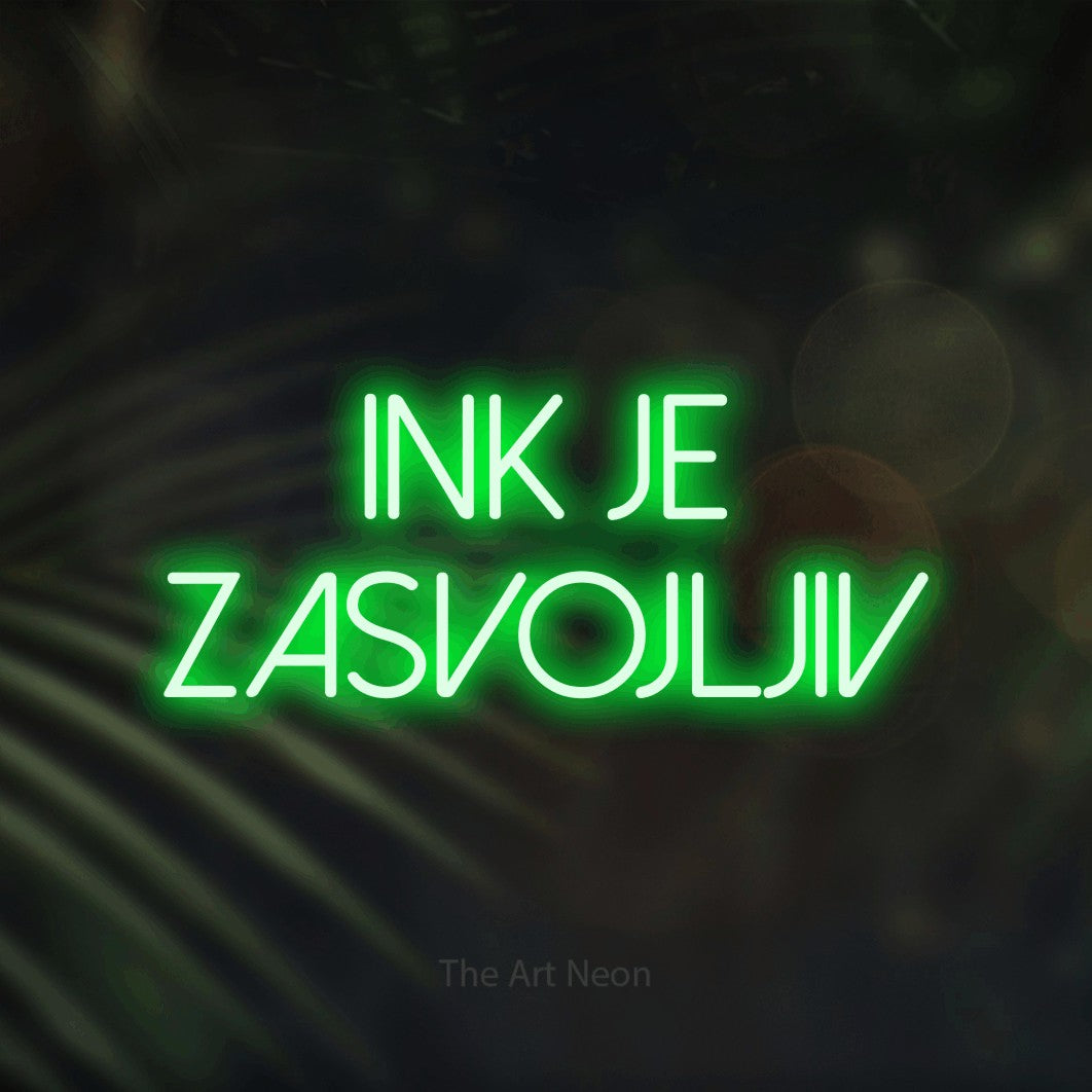 LED neon sign reading “ink je zasvojljiv”, arranged in two lines.