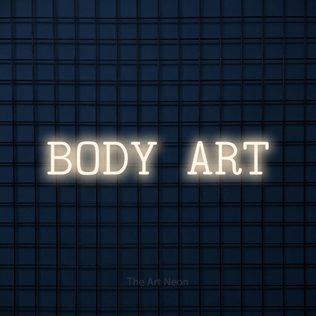LED neon sign reading “BODY ART”, arranged in a single line.