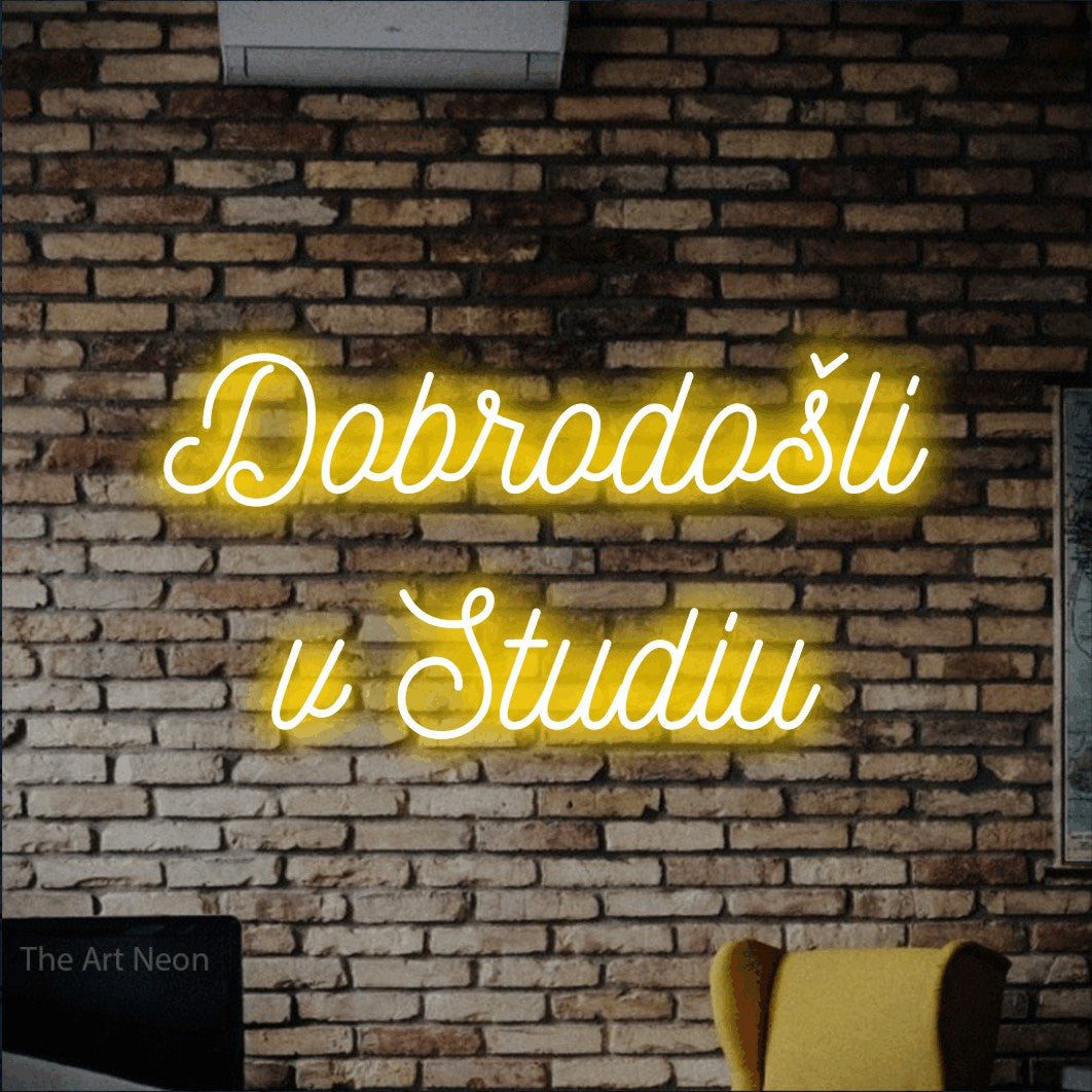 LED neon sign reading “Dobrodošli v Studiu”, arranged in two lines.