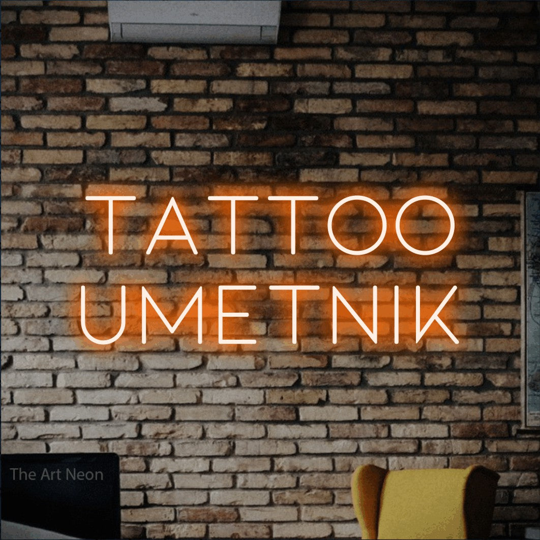 LED neon sign reading “Tattoo Umetnik”, arranged in two lines.