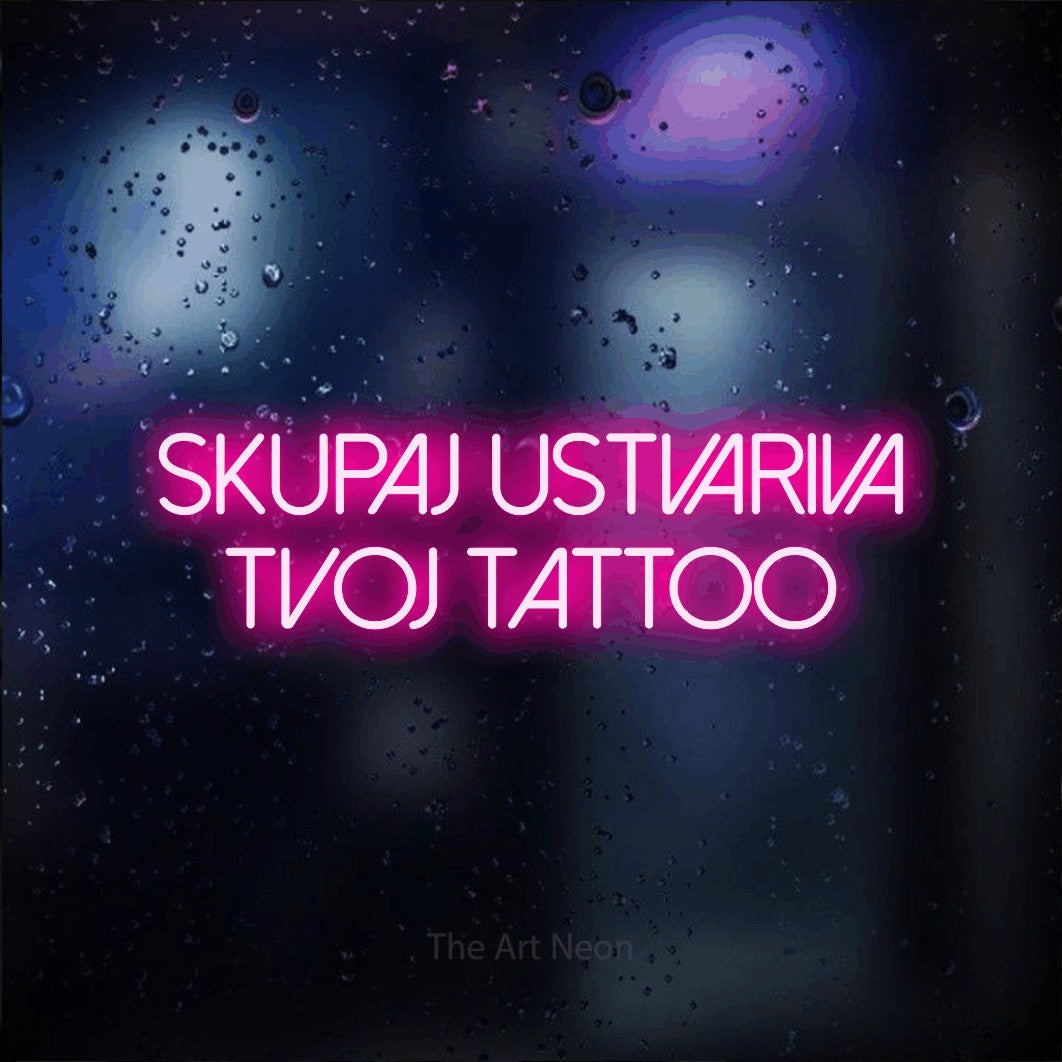 LED neon sign reading “Skupaj USTVARIVA Tvoj Tattoo”, arranged in two lines.