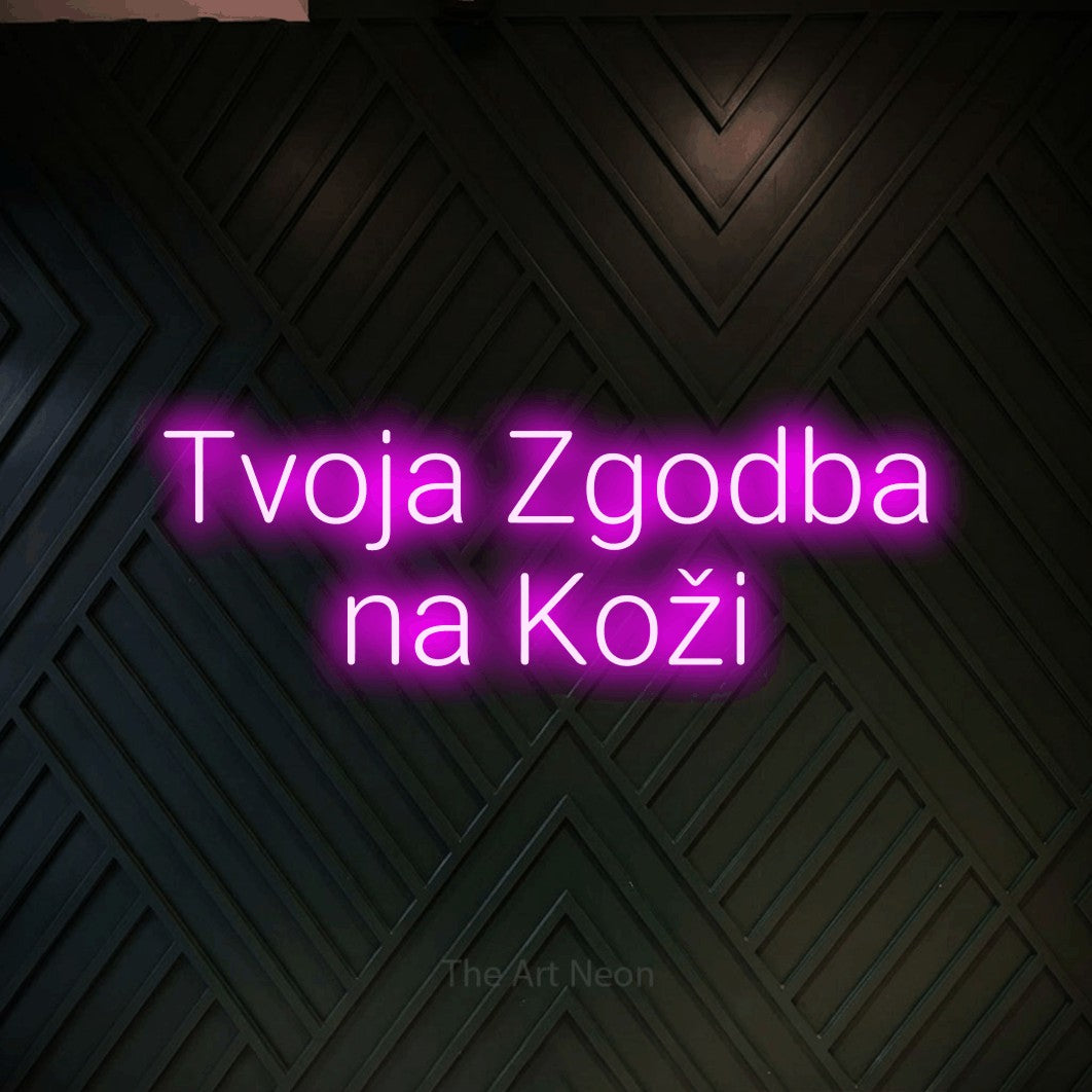 LED neon sign reading “Tvoja Zgodba na Koži”, arranged in two lines.