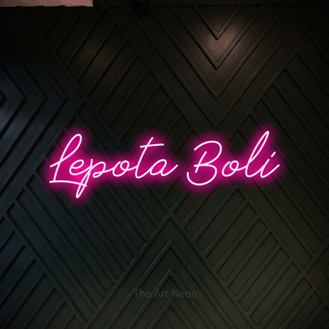 LED neon sign reading “Lepota Boli”, arranged in a single line.