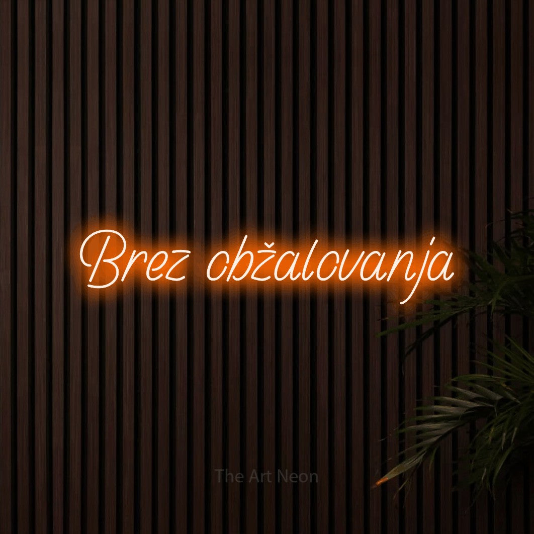 LED neon sign reading “Brez obžalovanja”, arranged in a single line.