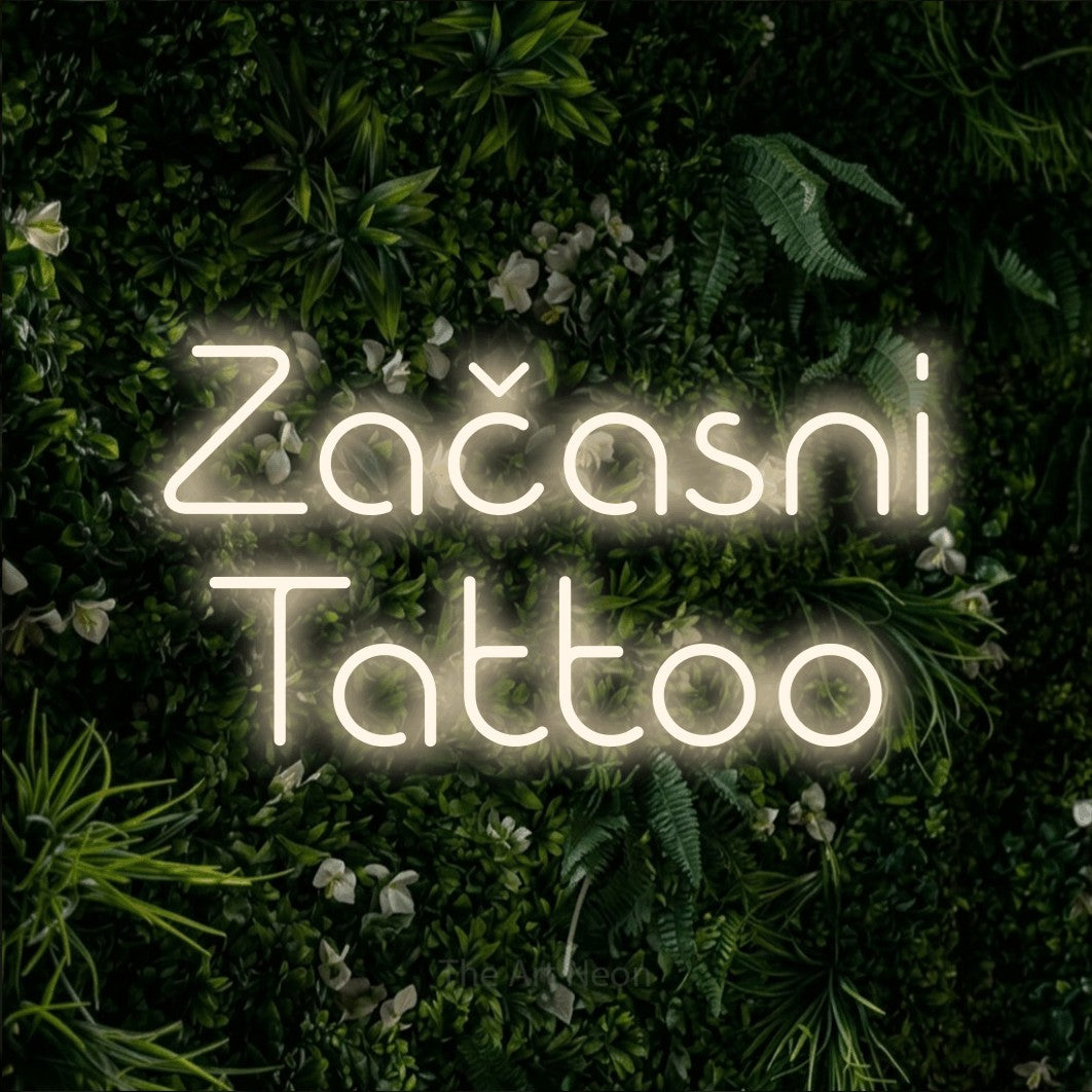 LED neon sign reading “Začasni Tattoo”, arranged in two lines.