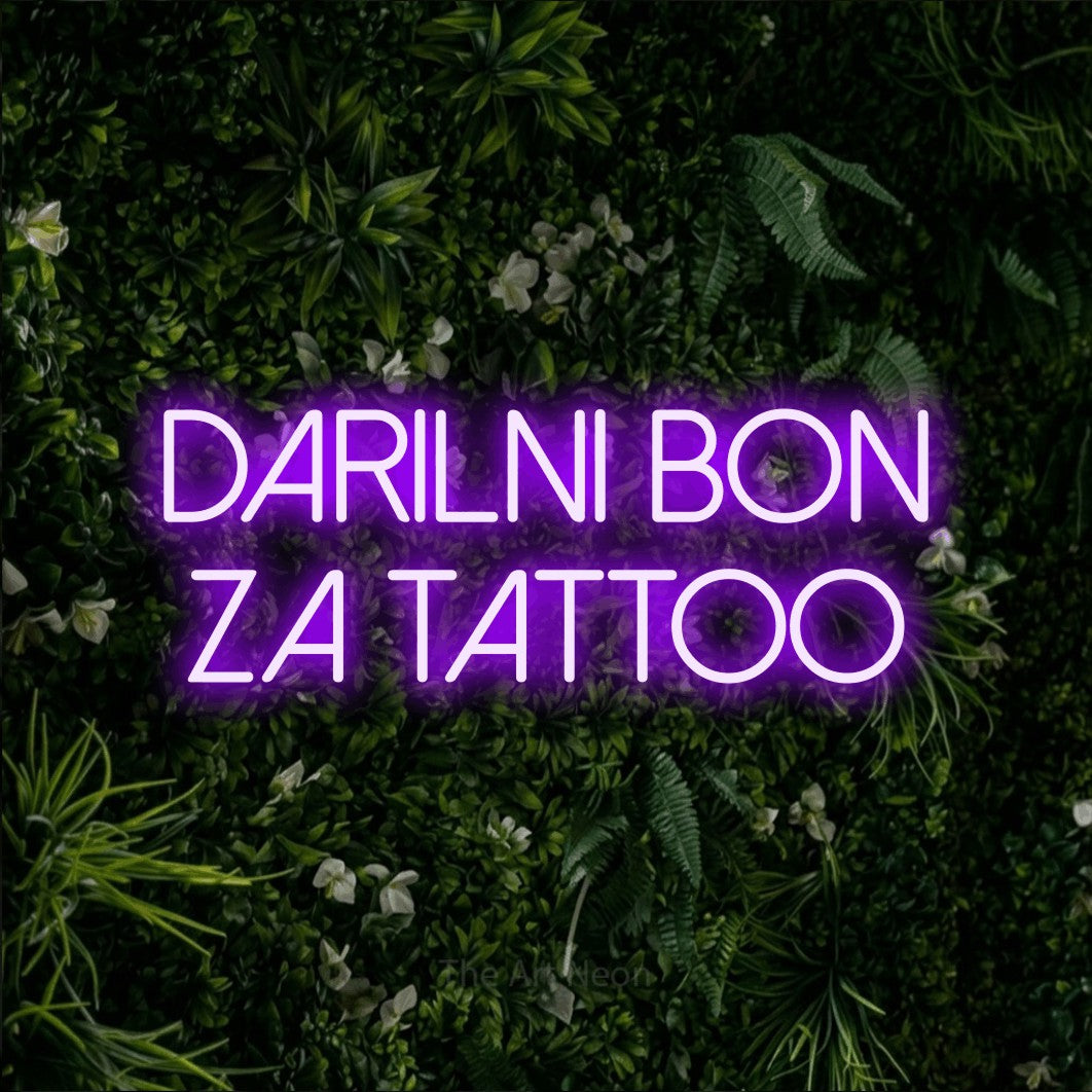LED neon sign reading “Darilni Bon za Tattoo”, arranged in two lines.