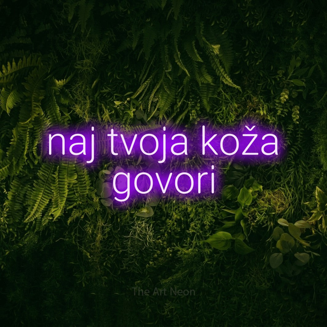 LED neon sign reading “naj tvoja koža govori”, arranged in two lines.