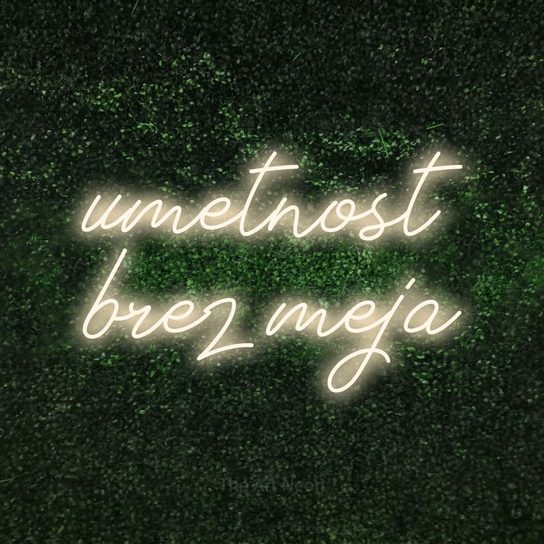 LED neon sign reading “umetnost brez meja”, arranged in two lines.