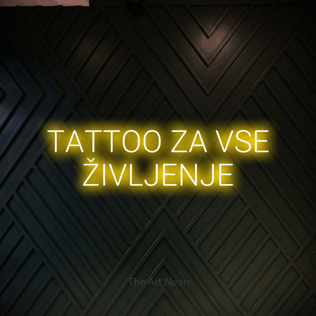 LED neon sign reading “TATTOO ZA VSE ŽIVLJENJE”, arranged in two lines.