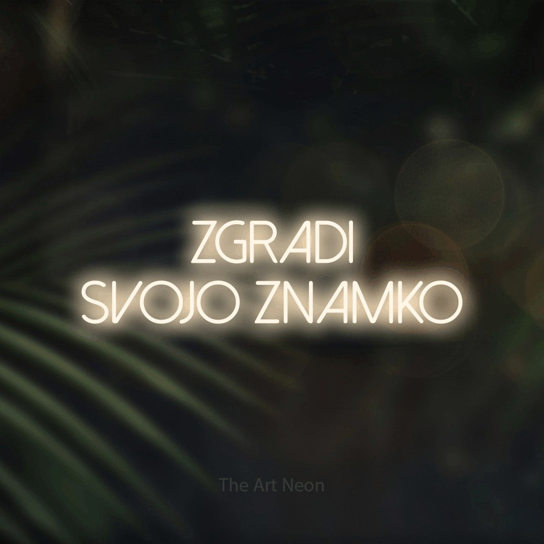 LED neon sign reading “zgradi svojo znamko”, arranged in two lines.