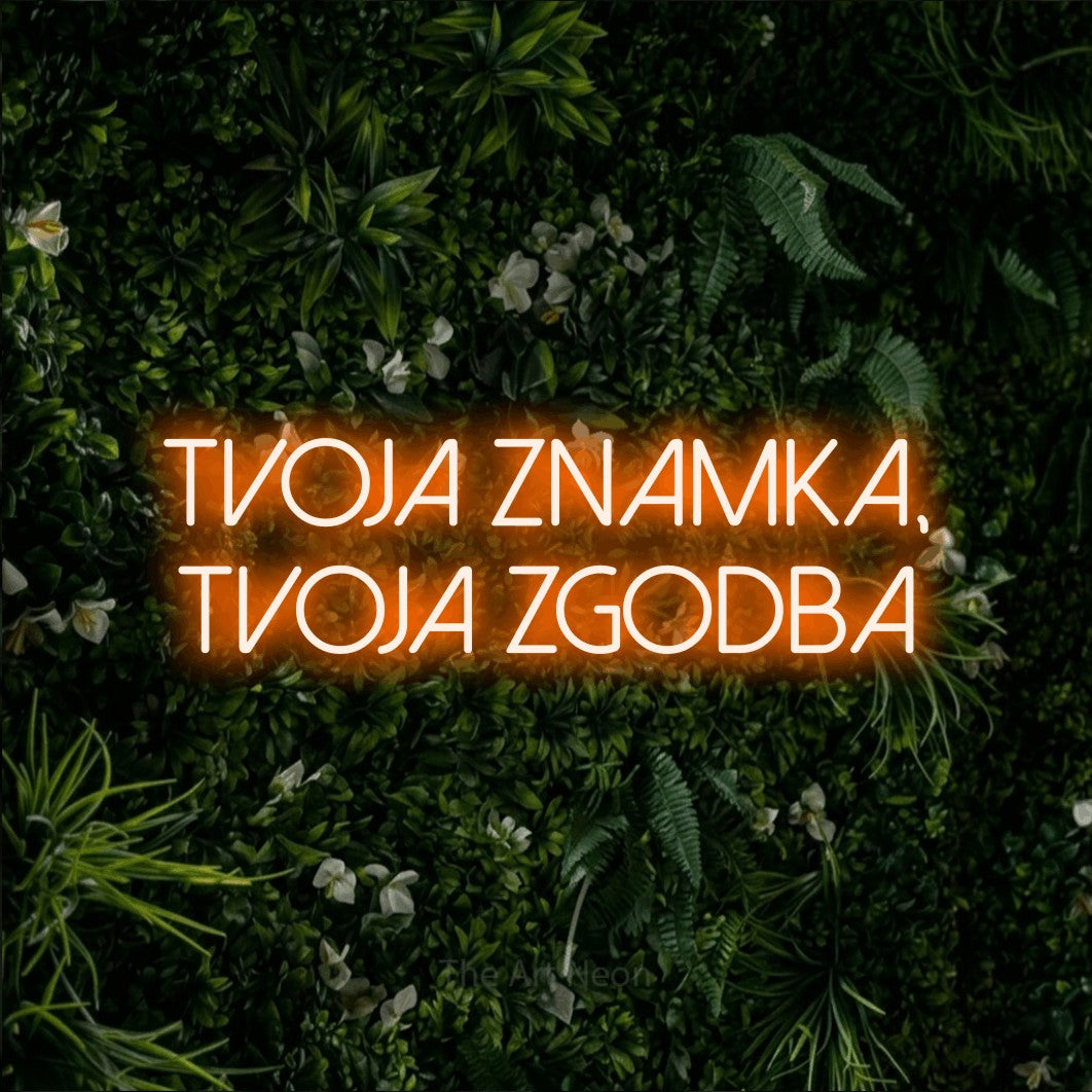 LED neon sign reading “tvoja znamka, tvoja zgodba”, arranged in two lines.
