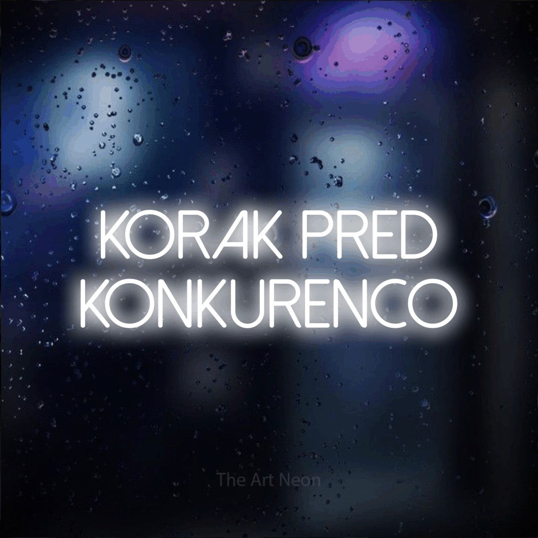 LED neon sign reading “korak pred konkurenco”, arranged in two lines.
