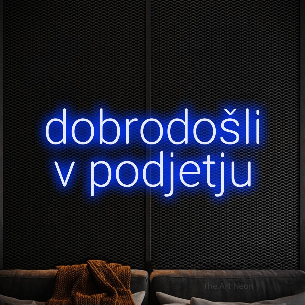 LED neon sign reading “dobrodošli v podjetju”, arranged in two lines.