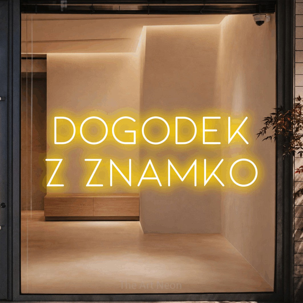 LED neon sign reading “DOGODEK z Znamko”, arranged in two lines.