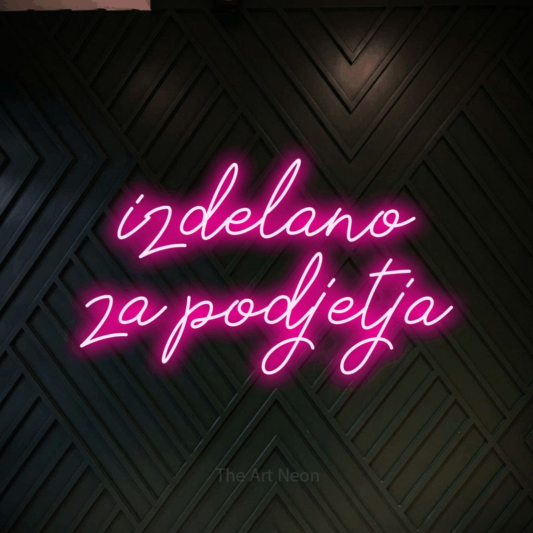 LED neon sign reading “izdelano za podjetja”, arranged in two lines.