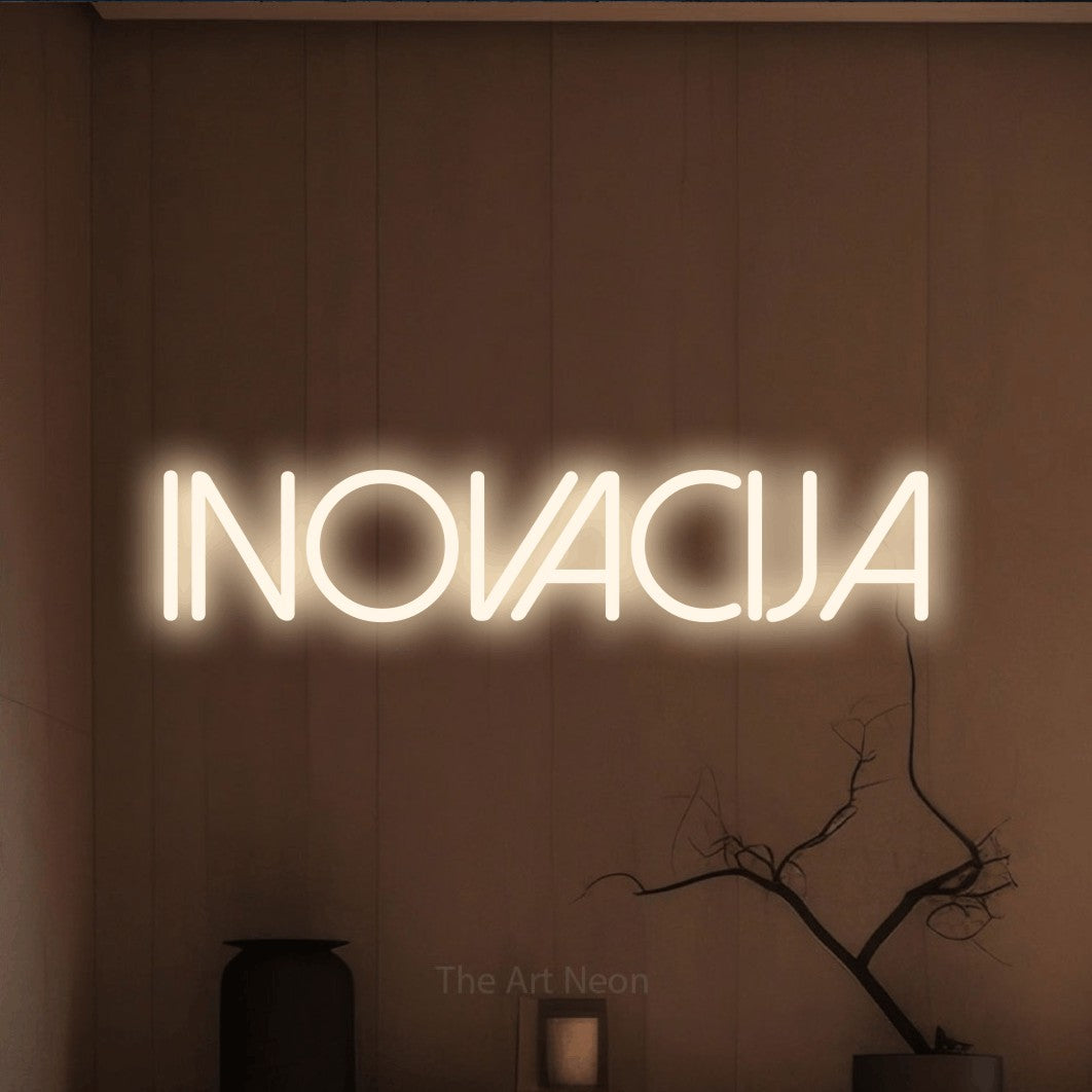 LED neon sign reading “INOVACIJA”, arranged in a single line.