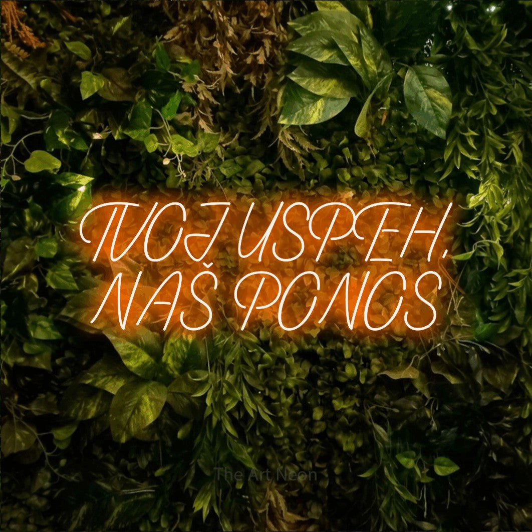 LED neon sign reading “TVOJ USPEH, NAŠ PONOS”, arranged in two lines.