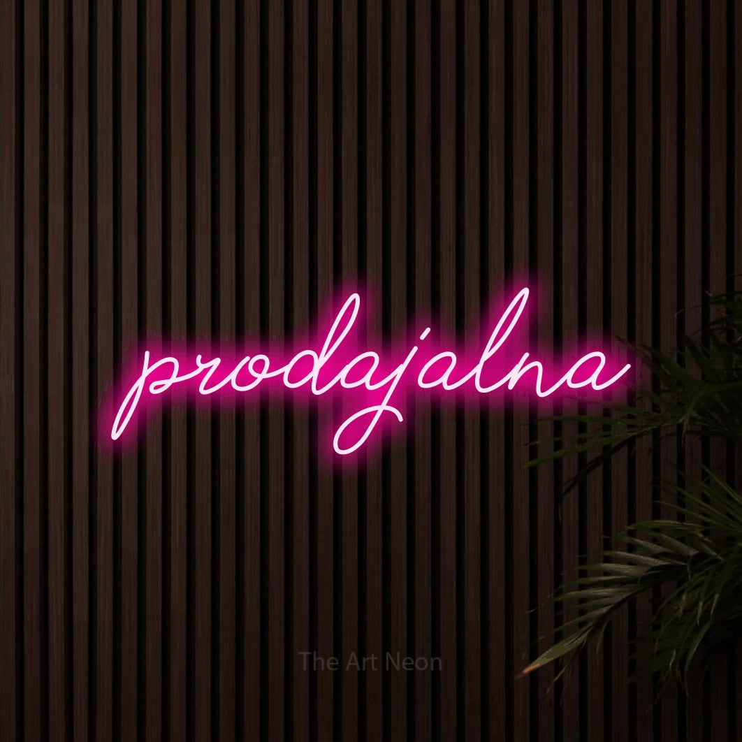 LED neon sign reading “prodajalna”, arranged in a single line.