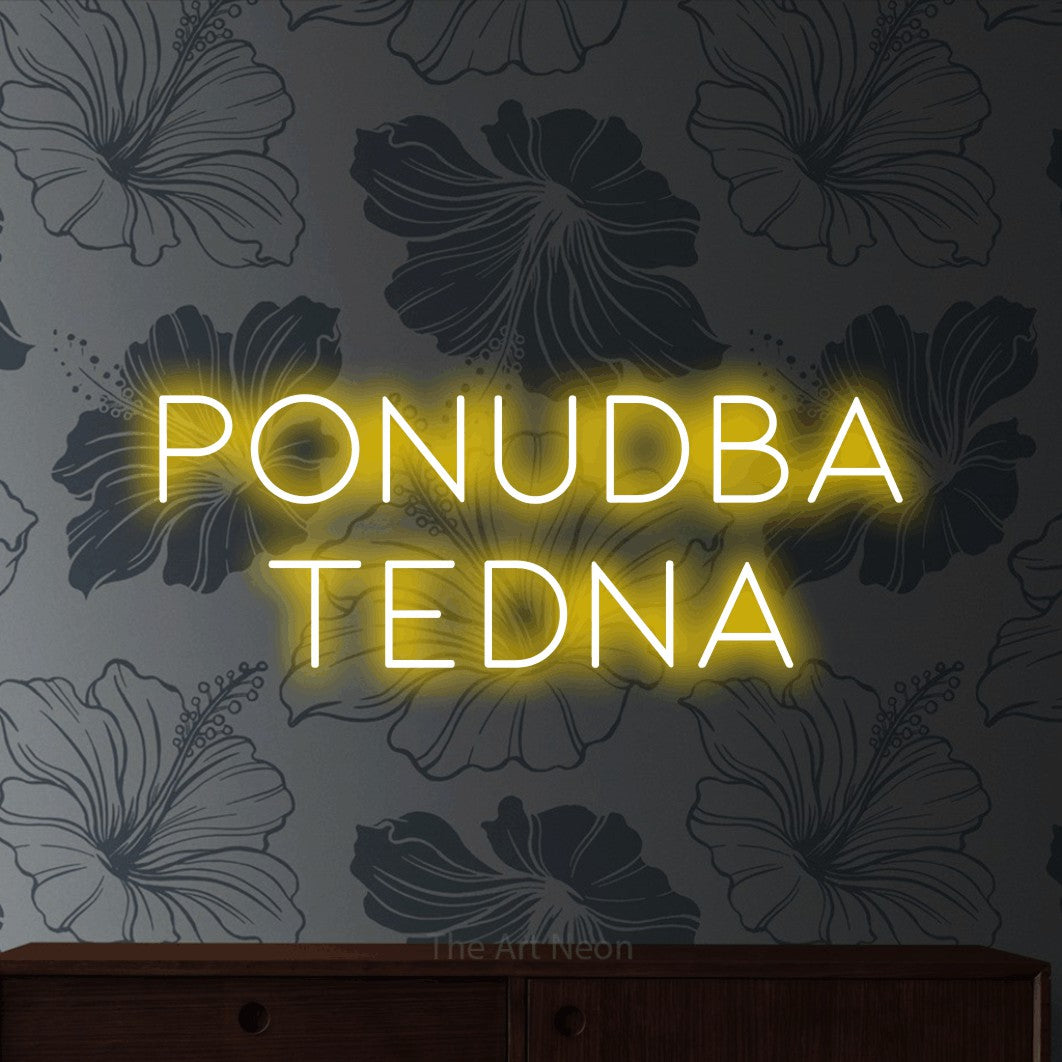 LED neon sign reading “ponudba tedna”, arranged in two lines.