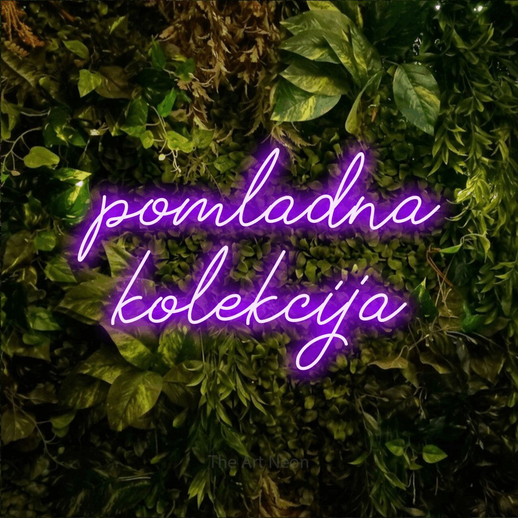 LED neon sign reading “pomladna kolekcija”, arranged in two lines.