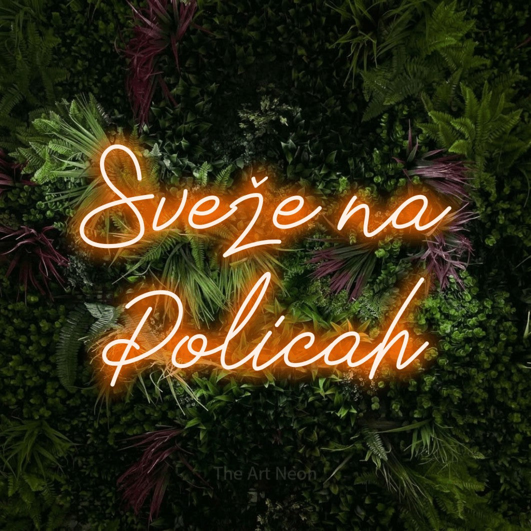 LED neon sign reading “Sveže na Policah”, arranged in two lines.