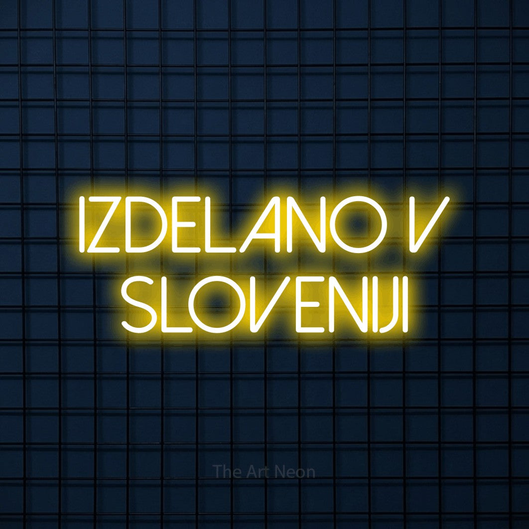 LED neon sign reading “Izdelano v Sloveniji”, arranged in two lines.