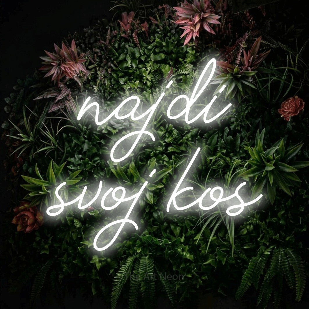 LED neon sign reading “najdi svoj kos”, arranged in two lines.