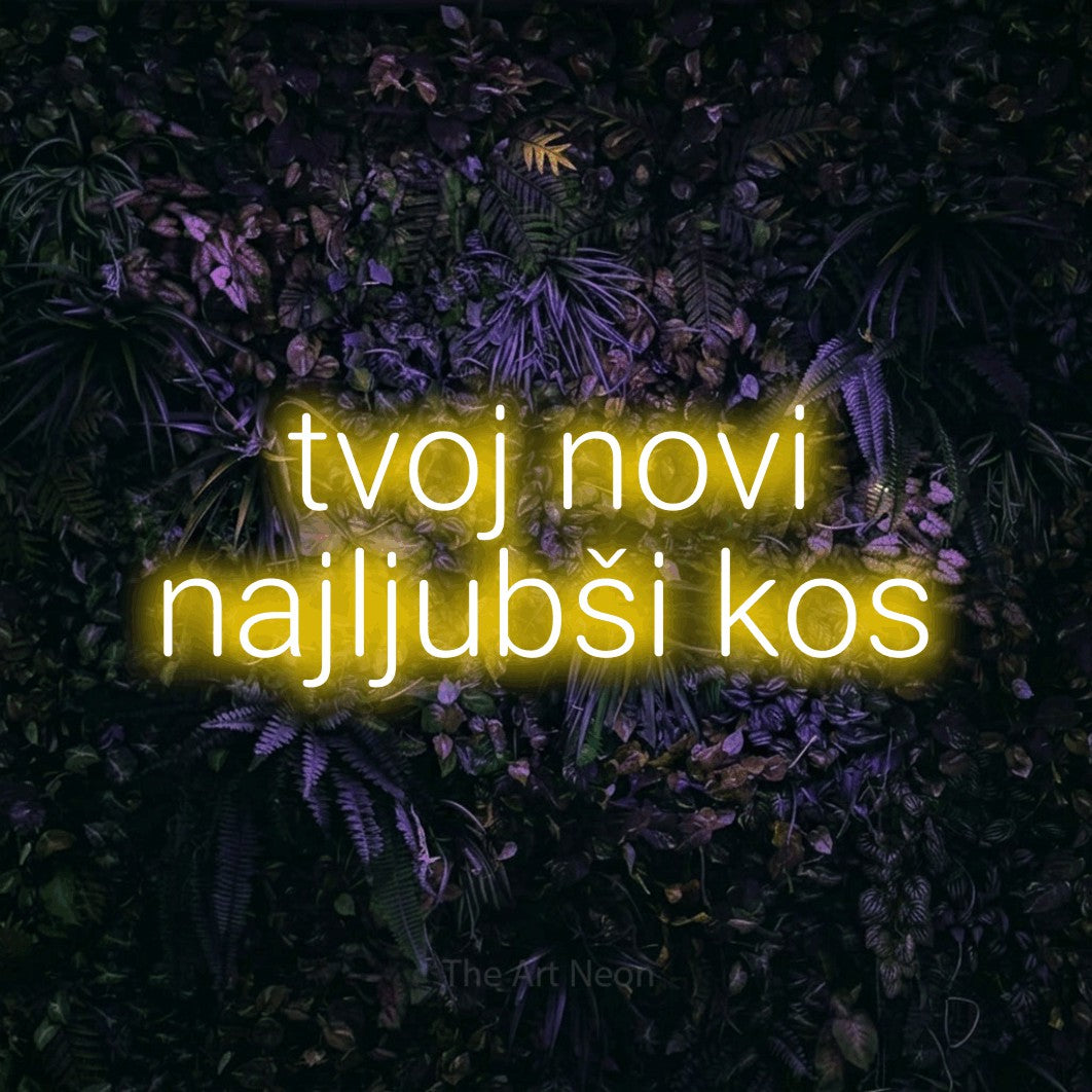 LED neon sign reading “tvoj novi najljubši kos”, arranged in two lines.