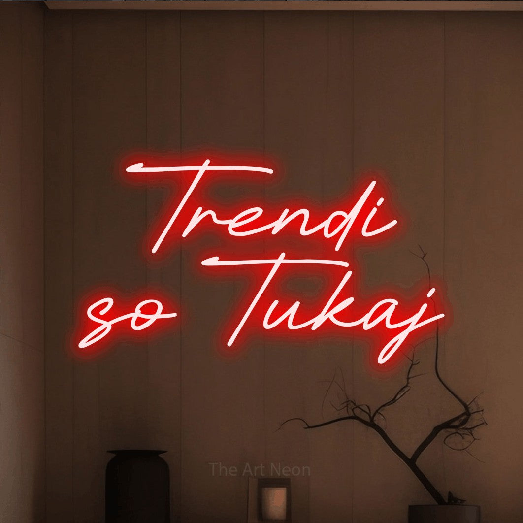 LED neon sign reading “Trendi so Tukaj”, arranged in two lines.