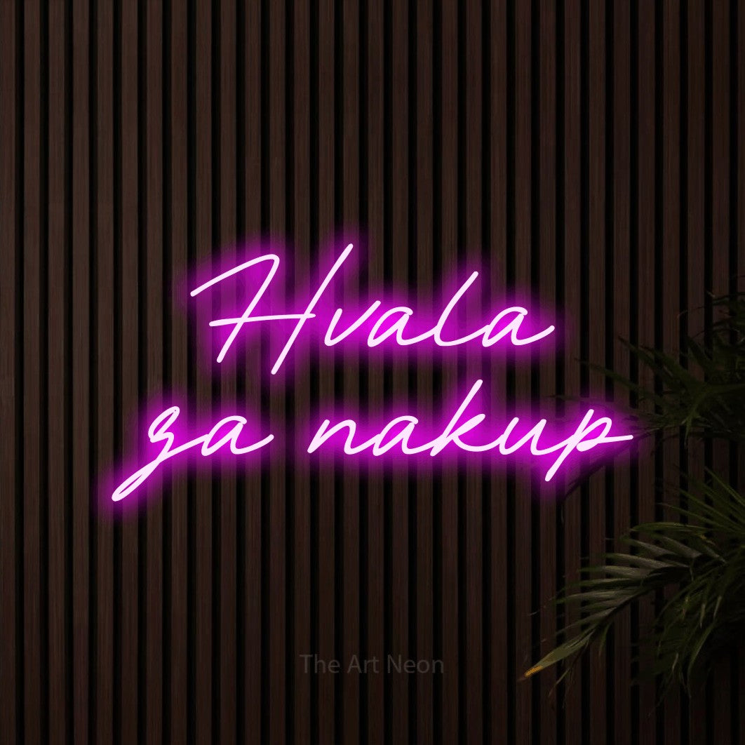 LED neon sign reading “Hvala za nakup”, arranged in two lines.