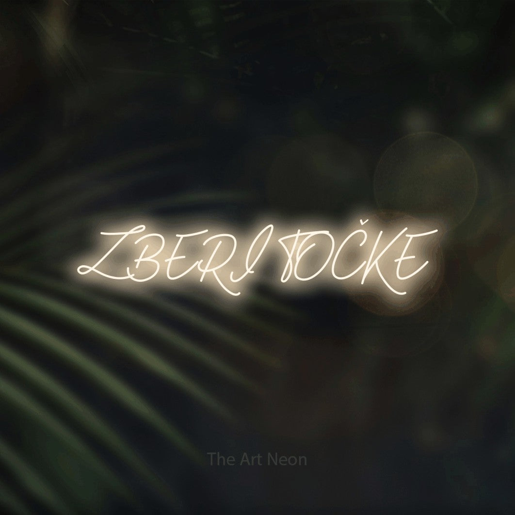 LED neon sign reading “ZBERI TOČKE”, arranged in a single line.