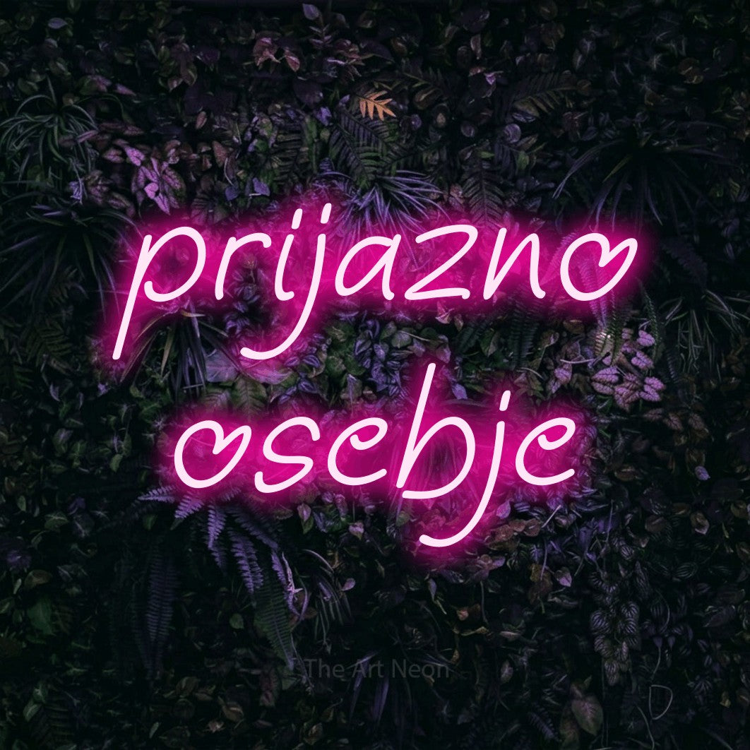LED neon sign reading “prijazno osebje”, arranged in two lines.