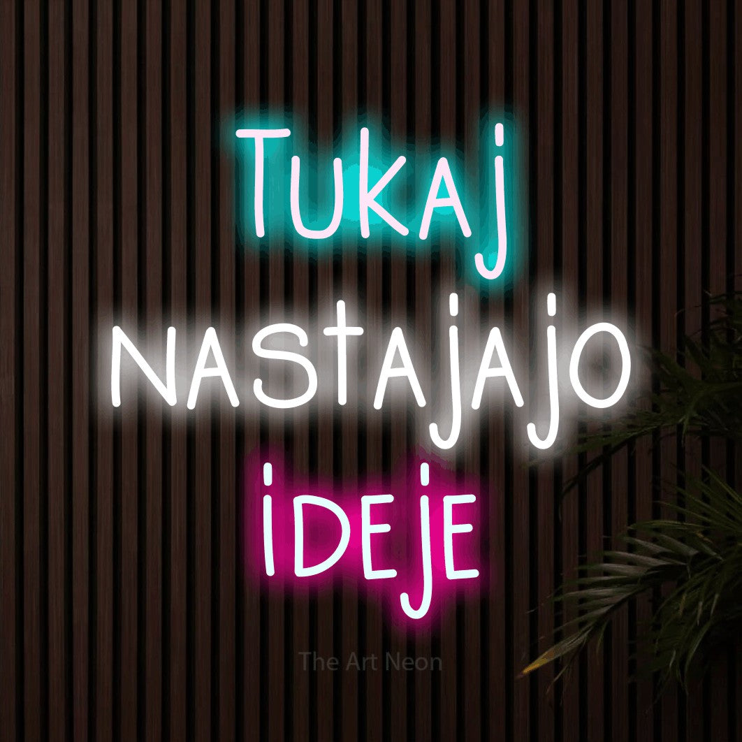 LED neon sign reading “Tukaj nastajajo ideje”, arranged in three lines.
