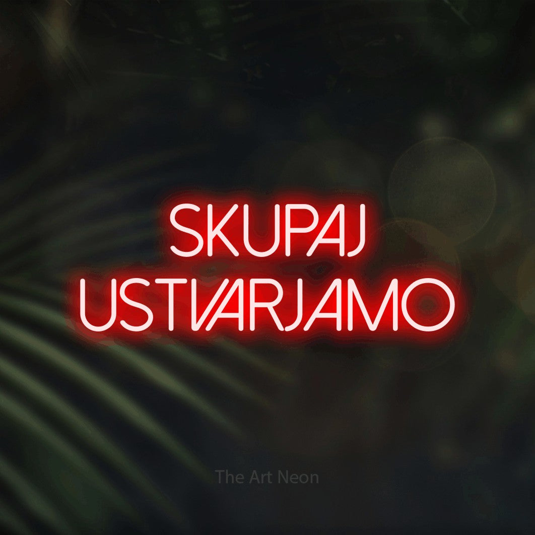LED neon sign reading “Skupaj Ustvarjamo”, arranged in two lines.