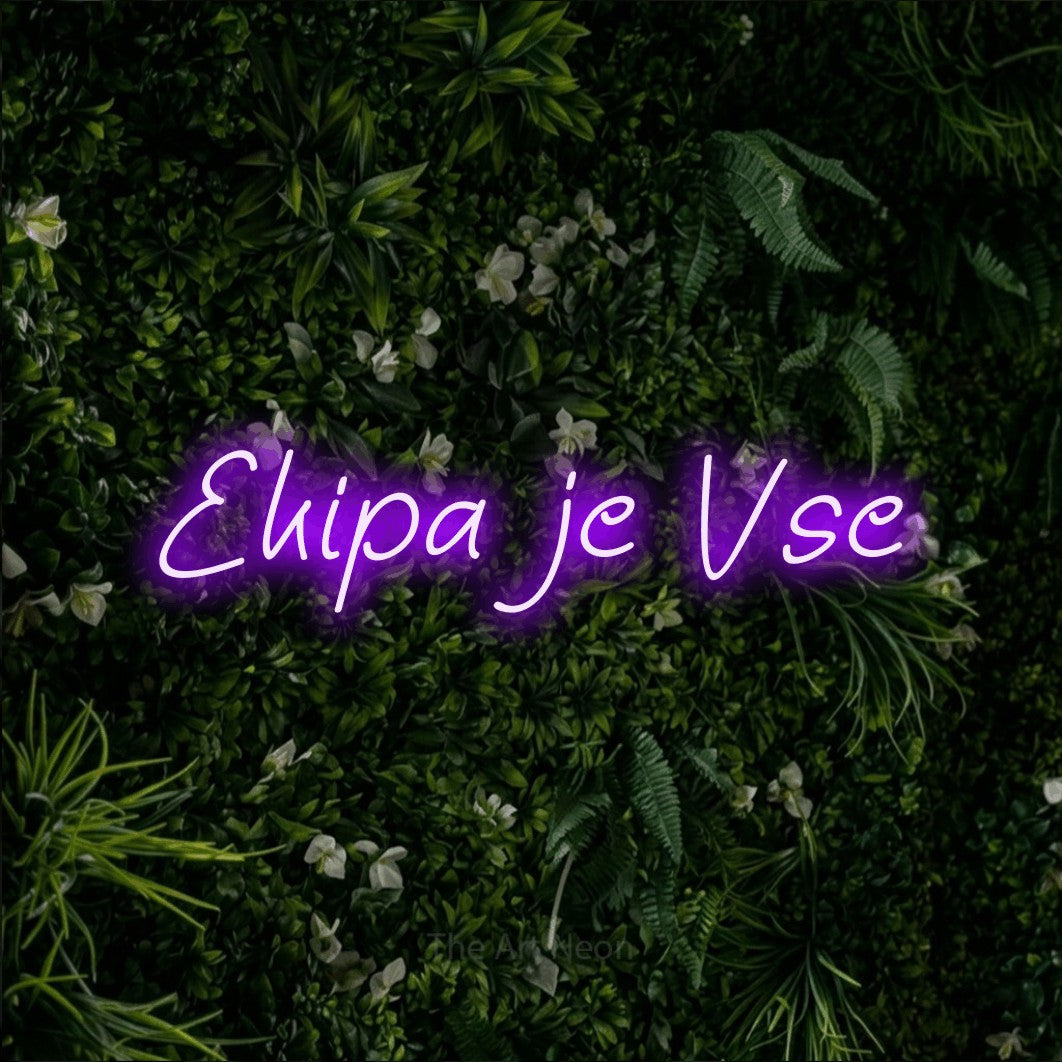 LED neon sign reading “Ekipa je Vse”, arranged in a single line.