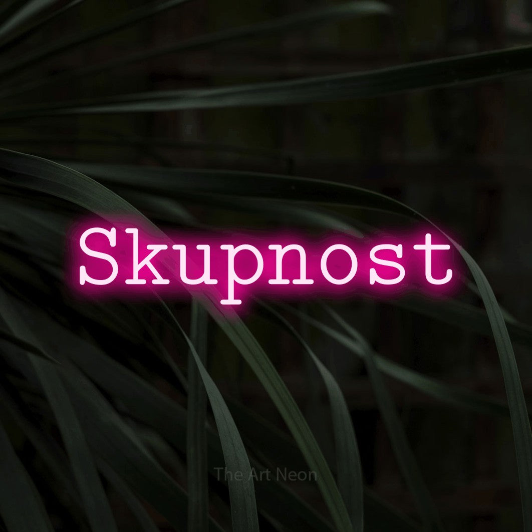 LED neon sign reading “Skupnost”, arranged in a single line.