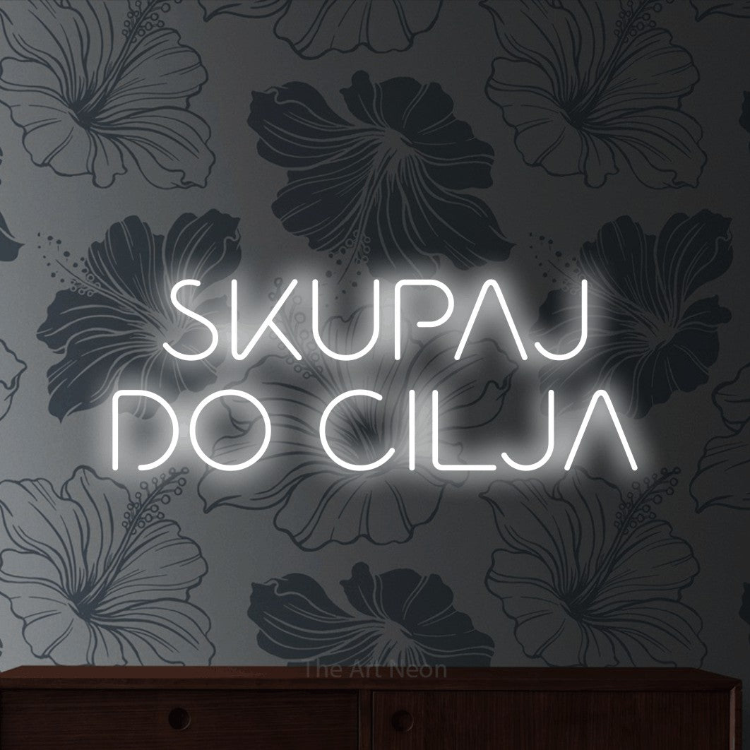 LED neon sign reading “SKUPAJ DO CILJA”, arranged in two lines.