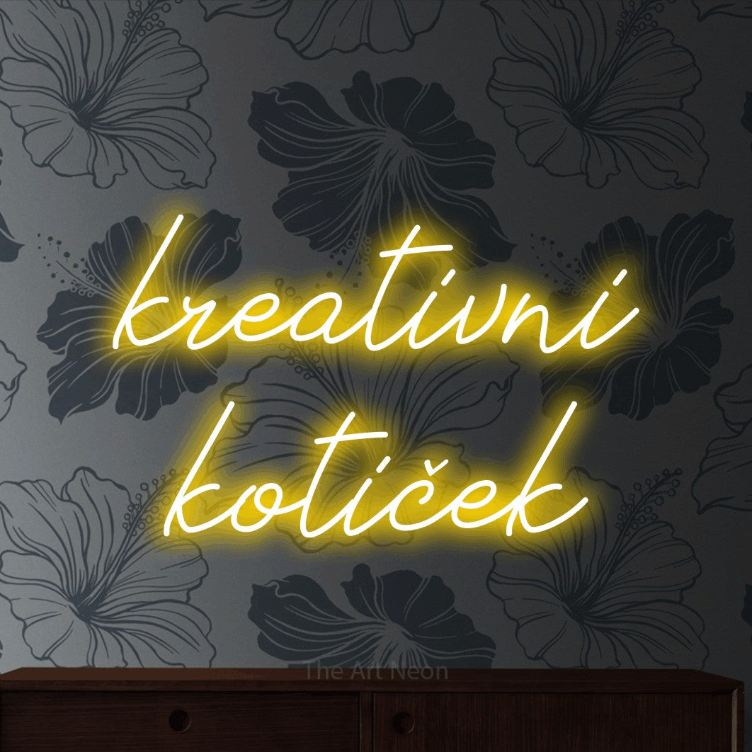 LED neon sign reading “kreativni kotiček”, arranged in two lines.