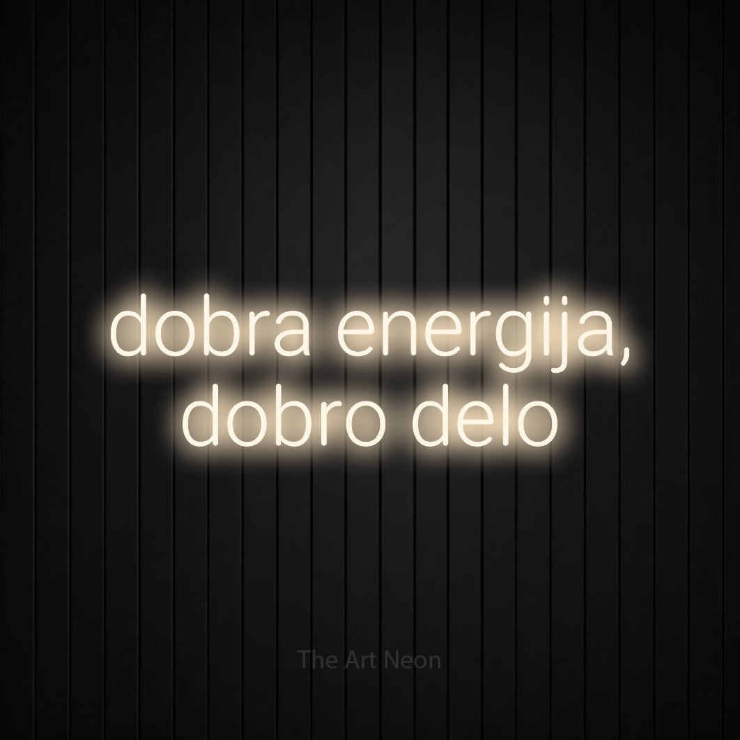 LED neon sign reading “dobra energija, dobro delo”, arranged in two lines.