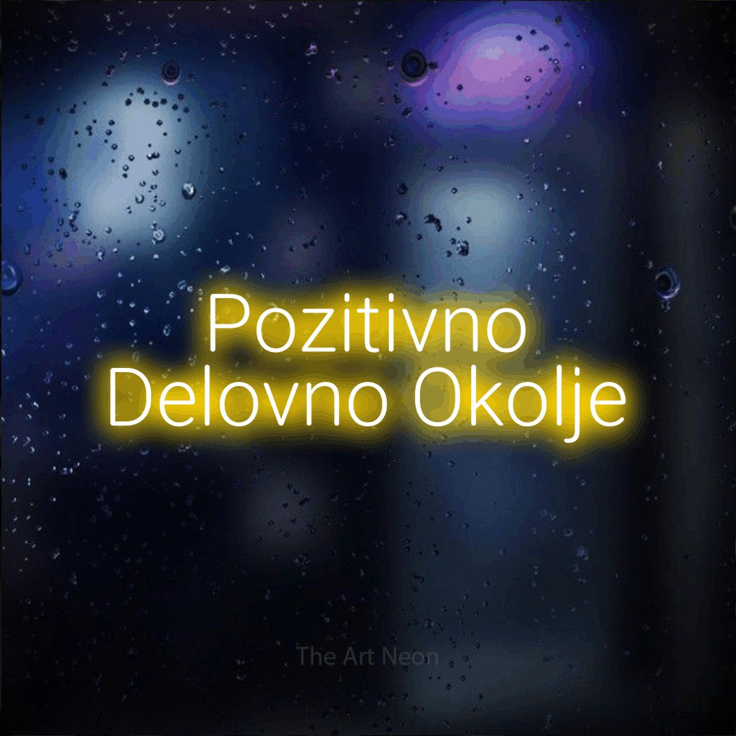 LED neon sign reading “Pozitivno Delovno Okolje”, arranged in two lines.