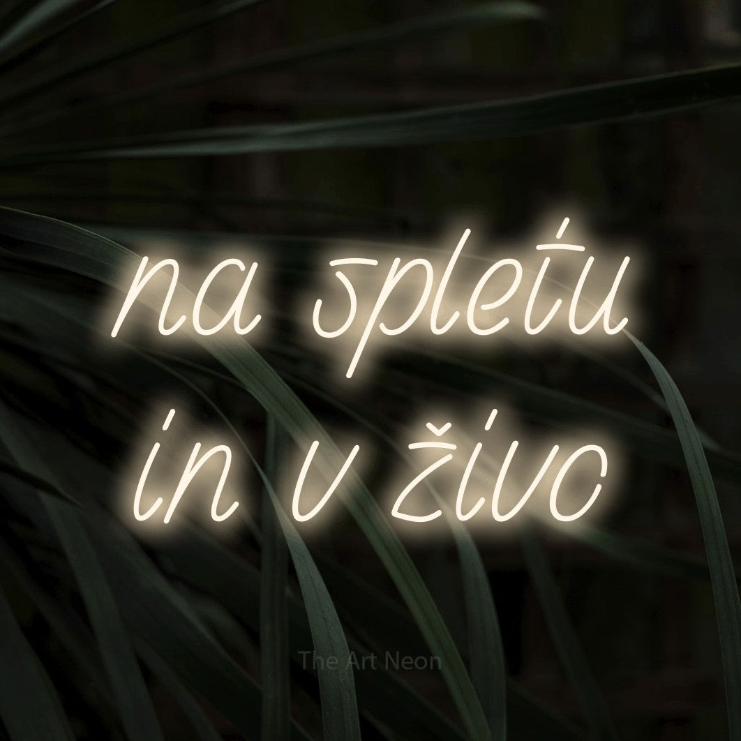 LED neon sign reading “na spletu in v živo”, arranged in two lines.