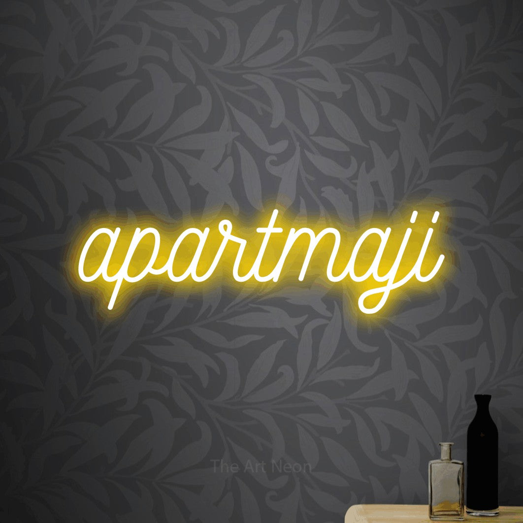 LED neon sign reading “apartmaji”, arranged in a single line.