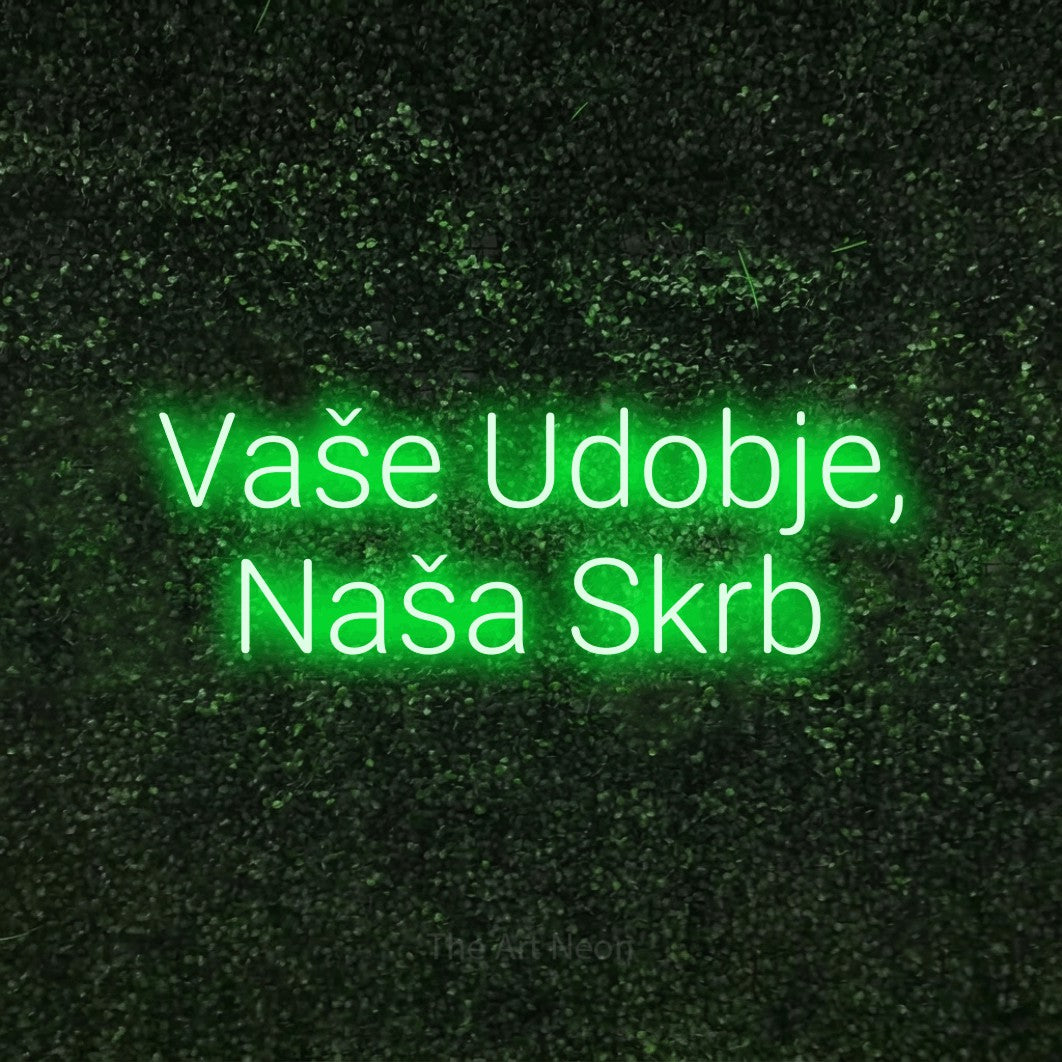 LED neon sign reading “Vaše Udobje, Naša Skrb”, arranged in two lines.