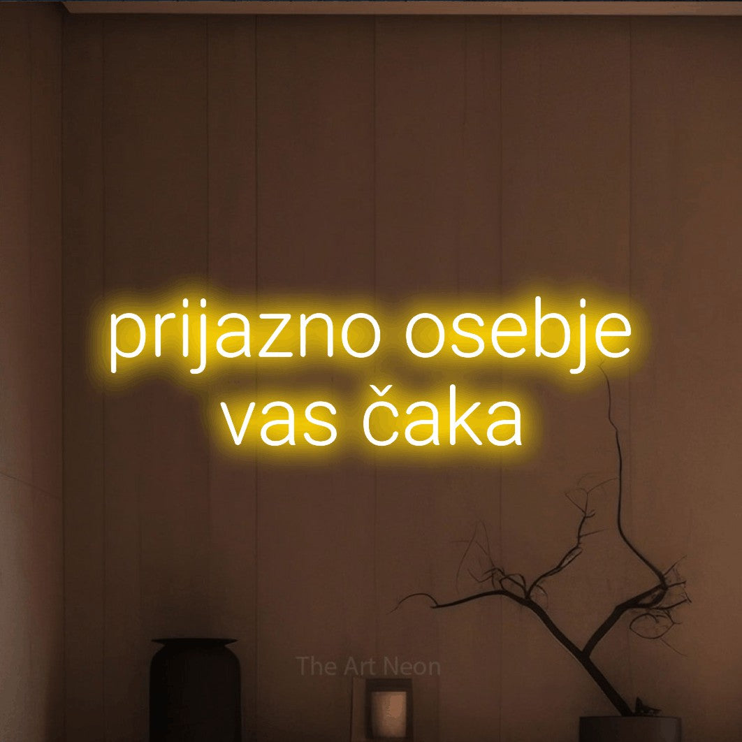 LED neon sign reading “prijazno osebje vas čaka”, arranged in two lines.